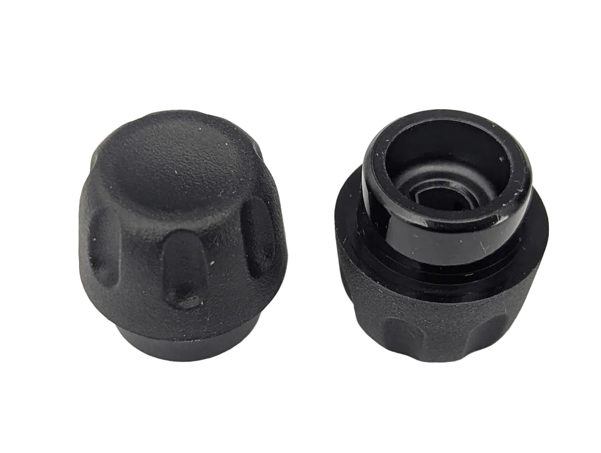 Two black plastic knobs on a white background